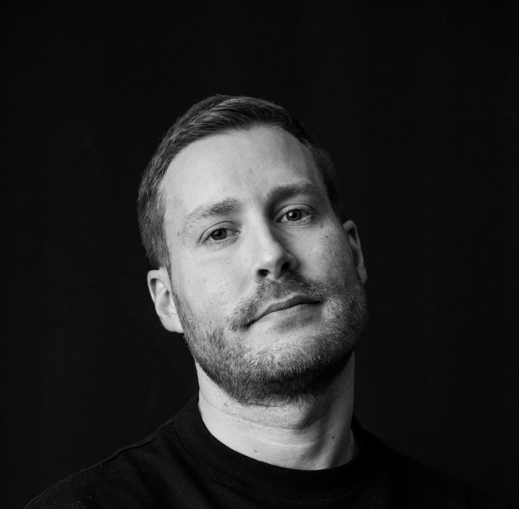 white graphic of the letters & Systwms